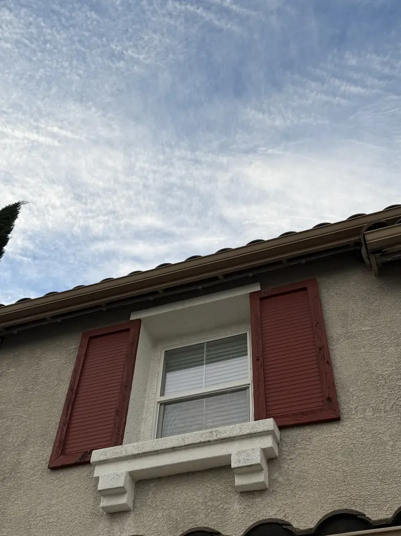 Daytime view of a roof edge where the lights are barely visible