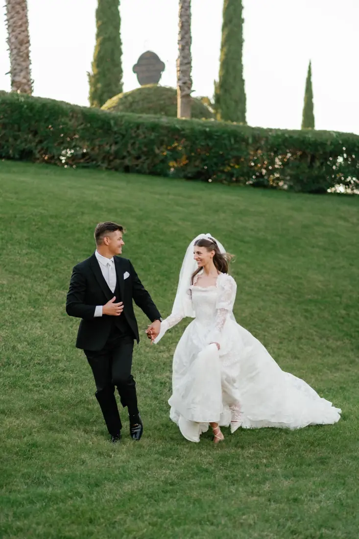 David and his wife walking hand in hand on their wedding day