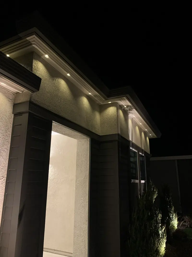 Close view of warm white lights under the eaves