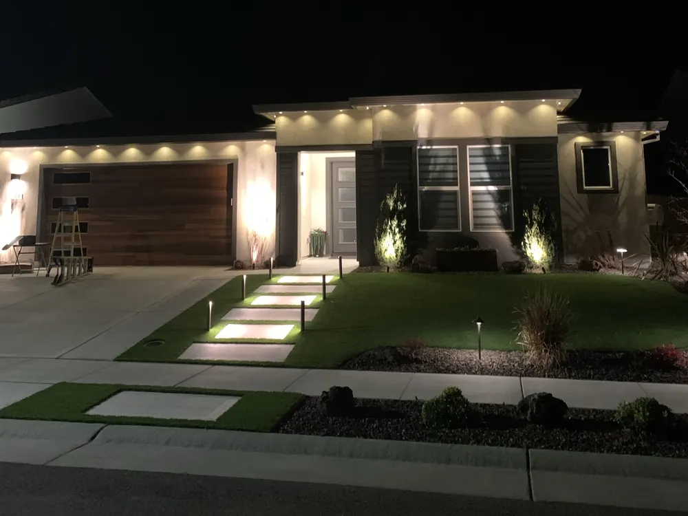 Home with a warm white roofline lit at night, installed by Chill Bear Lights